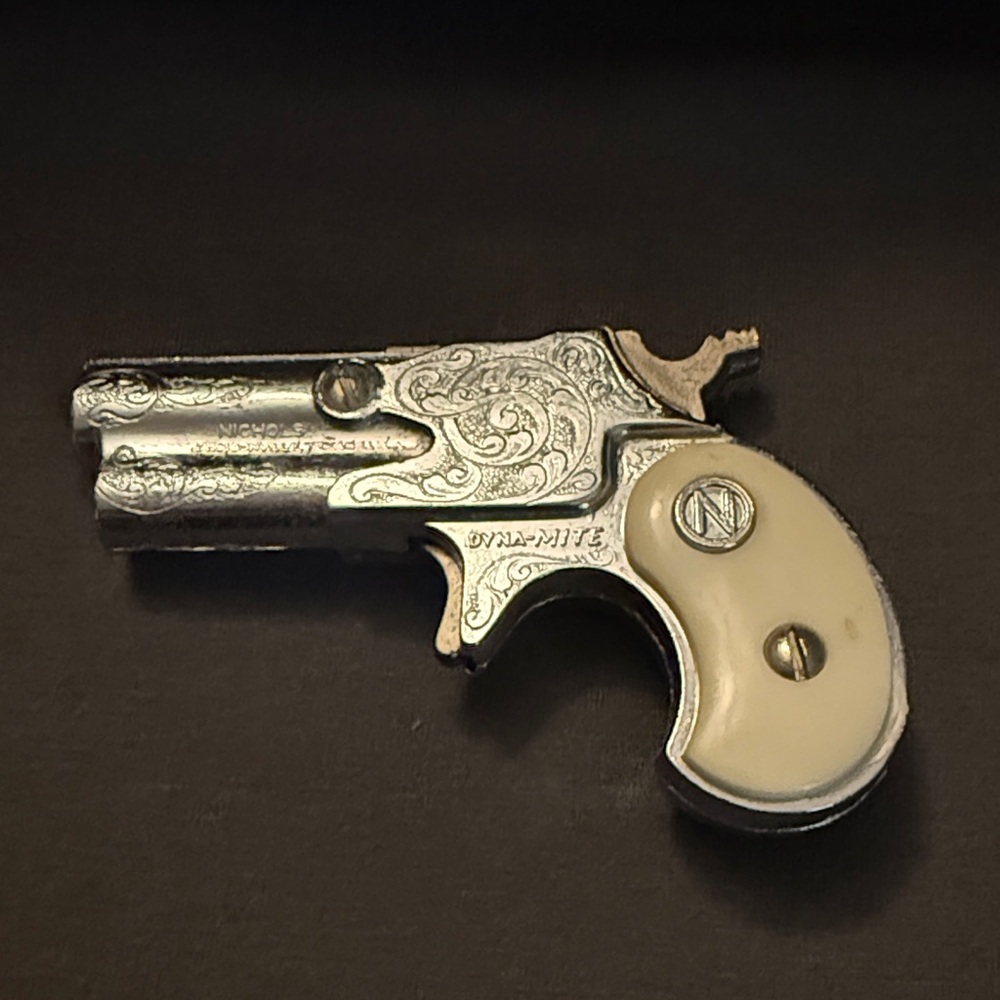 Dynamite Silver and Cream Engraved Cap Gun